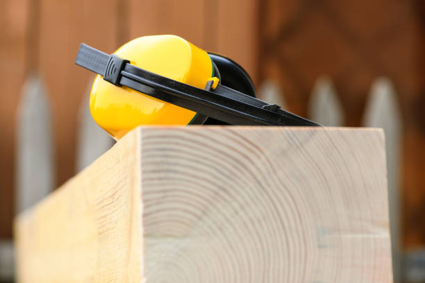 istock Protective earmuffs when working with wood in a sawmill , close up 1346394621