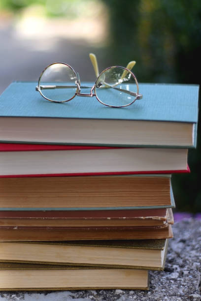 istock Vintage Books and Reading Glasses 1346394689