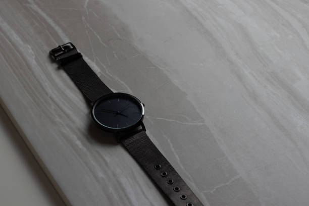 istock Close Up of Black Watch on Grey Background 1346396157