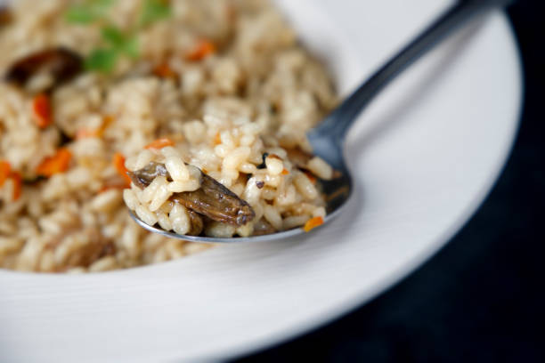 istock Risotto, Italian rice with mushrooms 1346397221