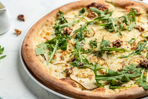 istock Fruit homemade sweet pear pizza with blue cheese, walnut and arugula 1346400611