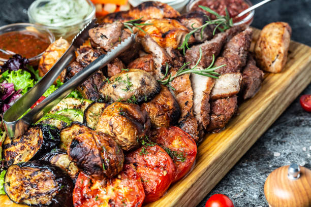 istock grilled meat platter and vegetables on tray. Grill Barbecue menu. Restaurant menu, dieting, cookbook recipe 1346401178