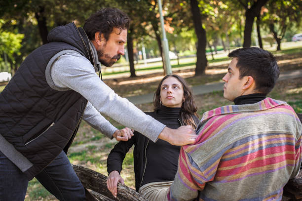 istock Adultery and infidelity. Girlfriend cheating his jealous boyfriend. Relationship polygamy 1346401544