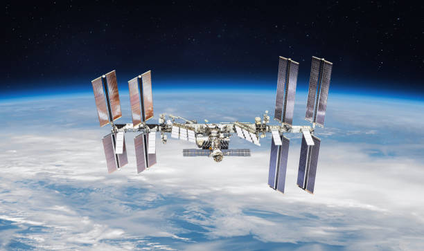international space station on orbit of the earth planet. view from outer space.iss. earth with clouds and blue sky. elements of this image furnished by nasa - nasa stockfoto's en -beelden