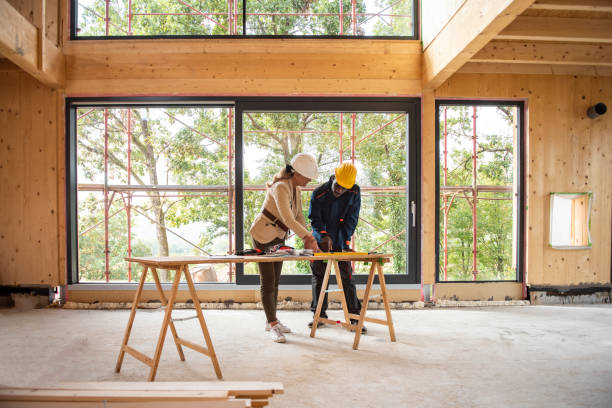 female architect and construction worker looking at plans - construction imagens e fotografias de stock