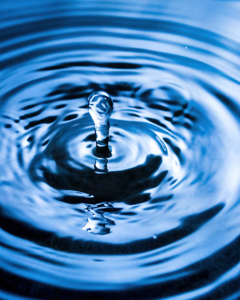 istock A drop of water and splashes with blurry waves on it. 1346404543