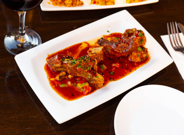 istock Grilled asian sticky pork ribs on plate 1346405270