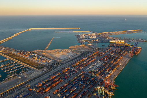 Aerial view of the container terminal of the seaport of the city of Valencia and the ship during loading