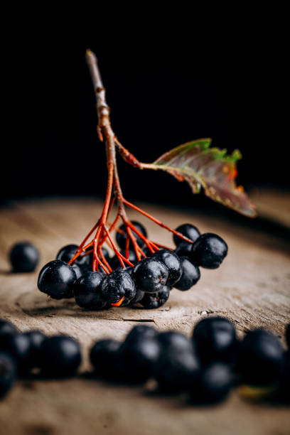 istock Chokeberry (Aronia melanocarpic) on a wooden table 1346405821