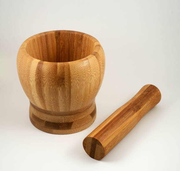 istock wooden mortar and pestle on white background 1346407099