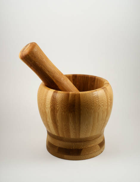 istock wooden mortar and pestle on white background 1346408991