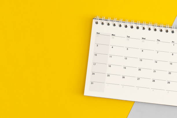 istock Calendar page on color background. Business planning 1346414999
