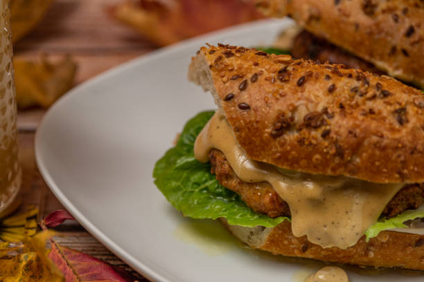 istock Chicken burger in seeds baguette with olive jalapenos dressing with pear juice 1346417230