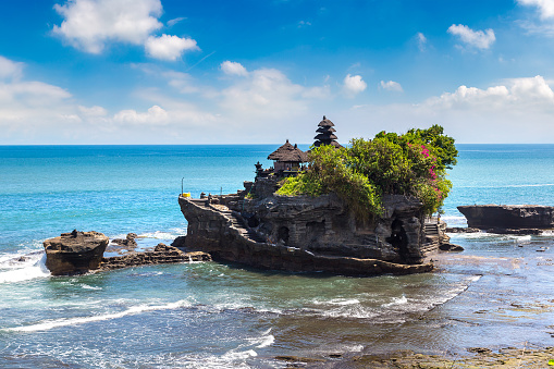 Panoramic view of Tanah Lot temple on Bali, Indonesia in a sunny day