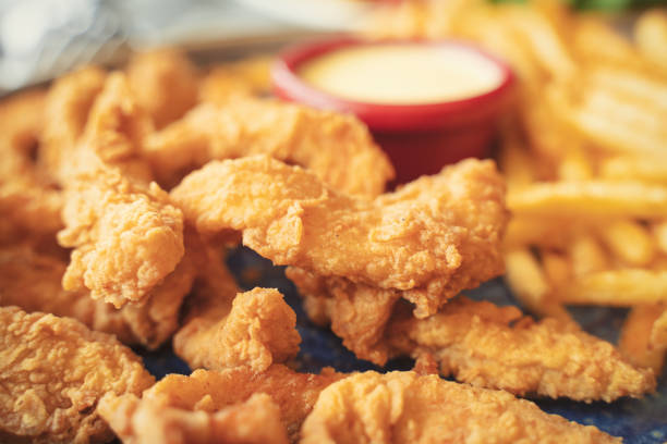 istock Fried chicken with french fries 1346419932