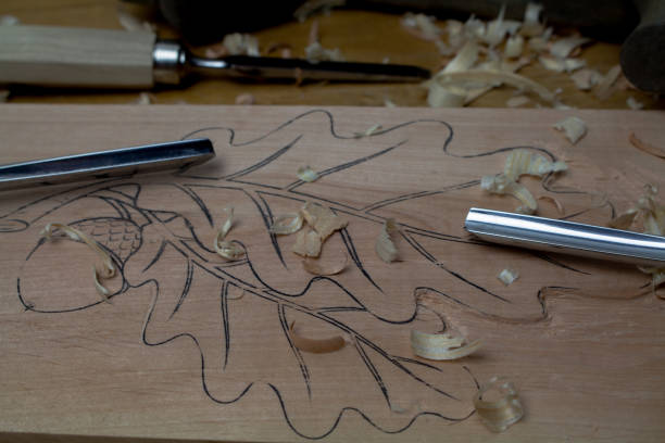 istock Carving chisels with carved board and shavings. 1346420496