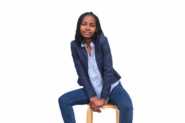istock Businesswoman sitting on a stool in a studio with a white background 1346420875