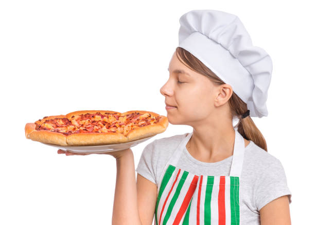 istock Girl chef holding pizza on white 1346421096