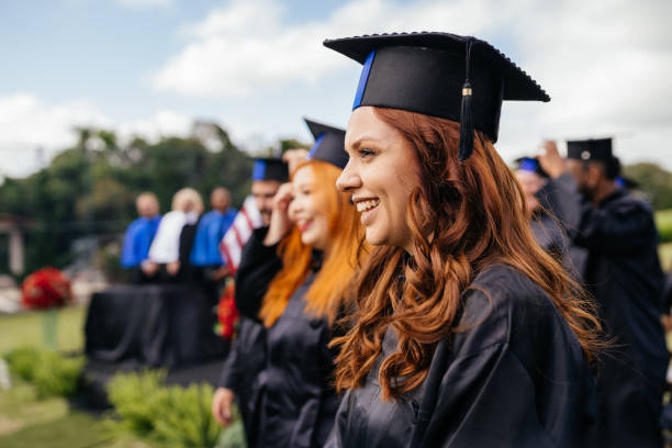 istock Smiling graduate at graduation ceremony 1346422676