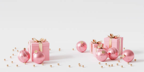 istock Pink gift boxes with golden ribbon and baubles on white background, 3d render 1346423647