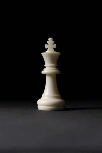 istock isolated white king chess piece on black background 1346425223