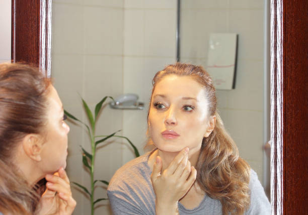 istock Applying the cream..Magic anti-aging cream. 1346426335