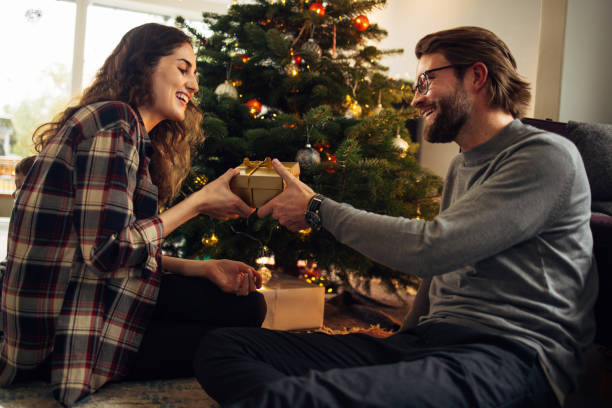 istock Couple exchanging Christmas gifts 1346426395