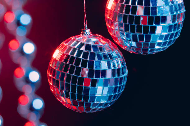 istock Sparkling disco balls hanging in the air against black background 1346426417