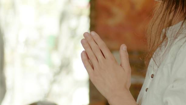 istock a woman who is praying 1346431498
