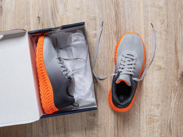 Sports shoes sneakers bright orange color. Sports in the open air. orange sport sneakers modern style. fitness and health