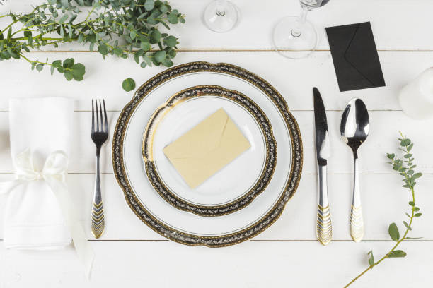 istock Vintage table setting on wooden table with floral decor 1346432834