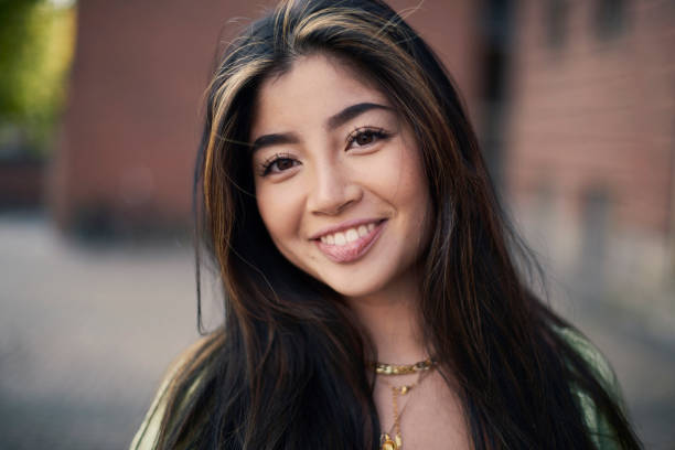 istock Asian young woman in park 1346432848