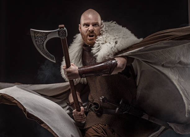 istock Weapon wielding viking warrior in studio shot 1346433482