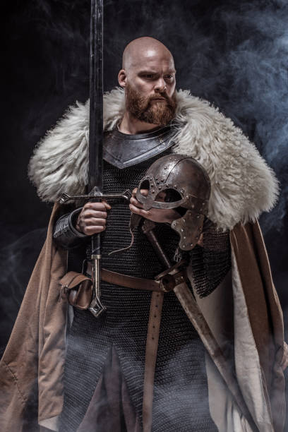 istock Weapon wielding viking warrior in studio shot 1346433532