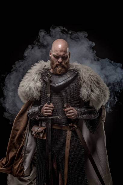 istock Weapon wielding viking warrior in studio shot 1346433551