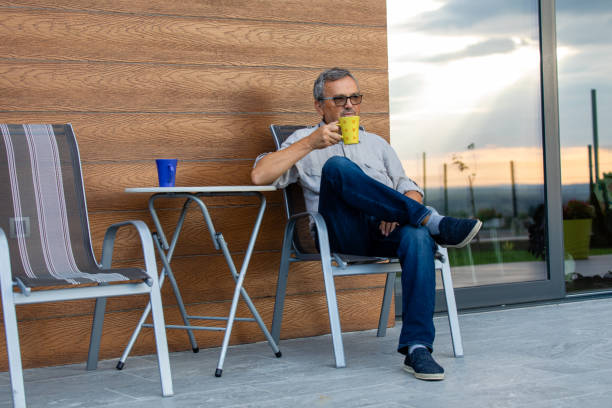 istock Mature Man Relaxing With a Cup of Coffee 1346434027