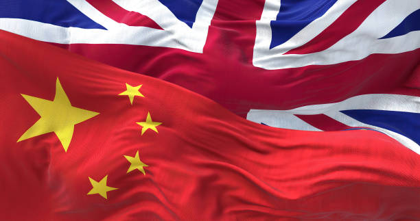 the flags of china and the united kingdom waving in the wind - british flag freedom photography english flag imagens e fotografias de stock