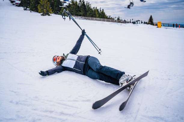 istock Skier woman lying in the snow 1346438178