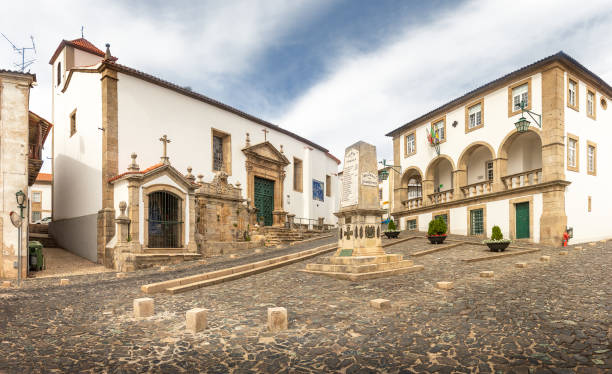 View of Largo do Principal in Bragança, Portugal, with the Church of São Vicente and the Do Principal Building in the background. stock photo