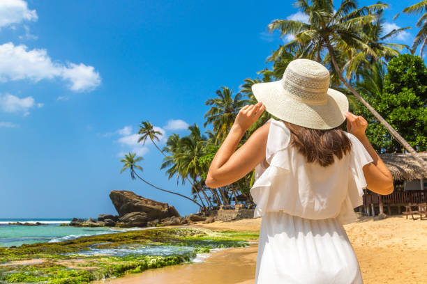 istock Woman on a tropical beach 1346441837