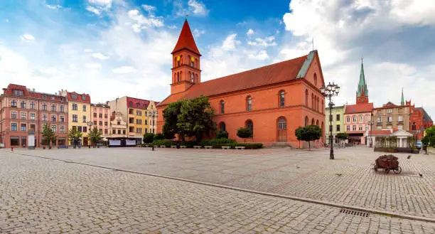 New Market Square and Catholic Church on a sunny day. Torun. Poland.