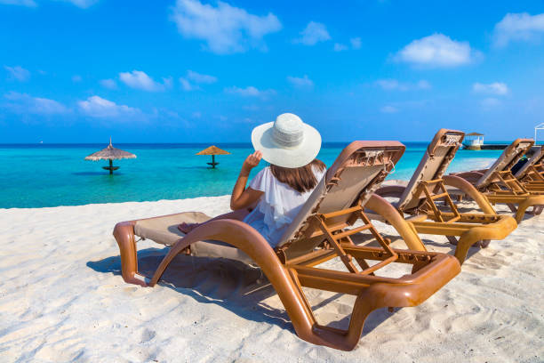 istock Woman lying in sunbed 1346442590