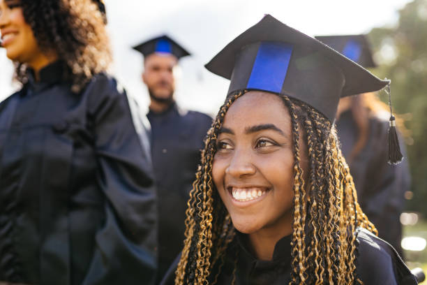 smiling graduate outdoors - grad portrait imagens e fotografias de stock