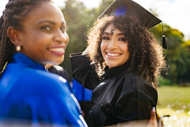 istock Teacher and student during outdoor graduation 1346443407
