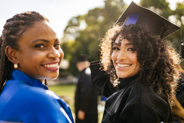 Teacher and student during outdoor graduation