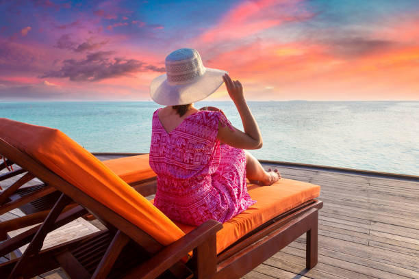 istock Woman lying in sunbed 1346446234