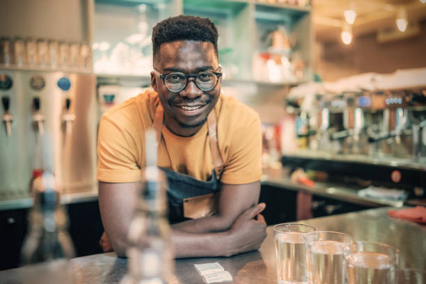 istock Portrait of happy bartender 1346447200