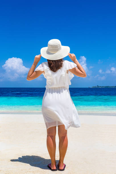 istock Woman stand at  beach 1346447233