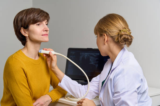 doctor doing ultrasound examination of blood vessels of throat and cervical arteries. usg scanner - ultrasound cancer healthcare and medicine thyroid gland imagens e fotografias de stock