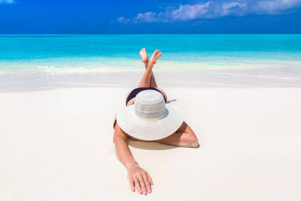 istock Woman at tropical beach 1346449738